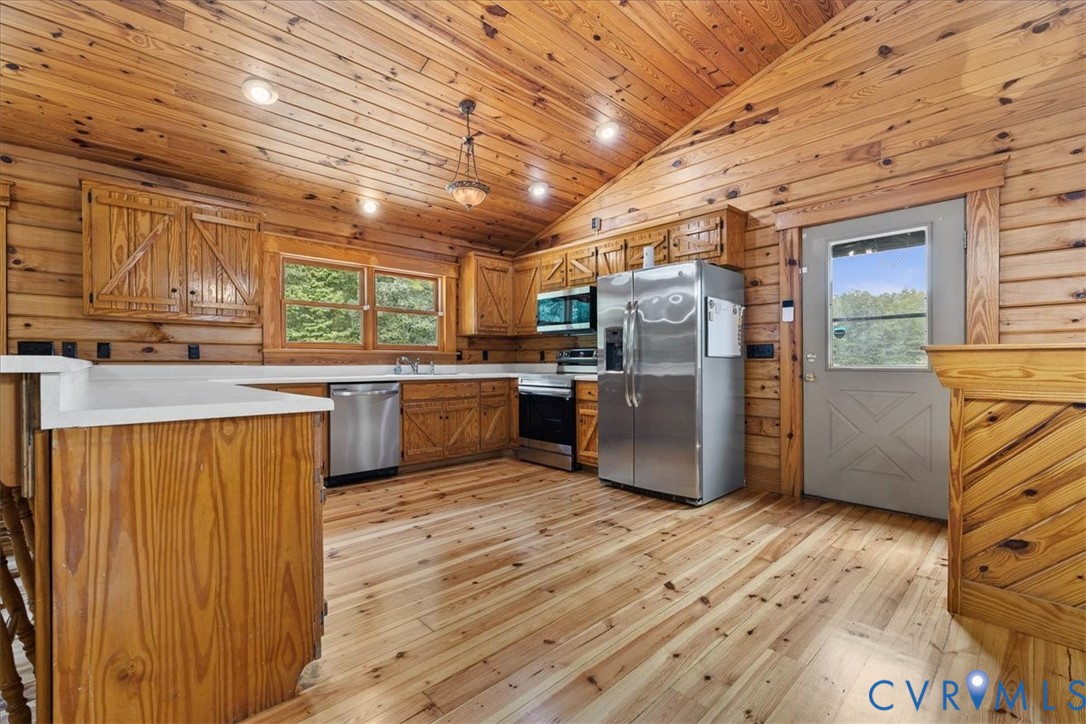 18901 Shippings Road Dewitt, VA 23840 - Photo 18 of 50 a kitchen with stainless steel appliances granite countertop a refrigerator a sink dishwasher a stove with wooden cabinets and floor