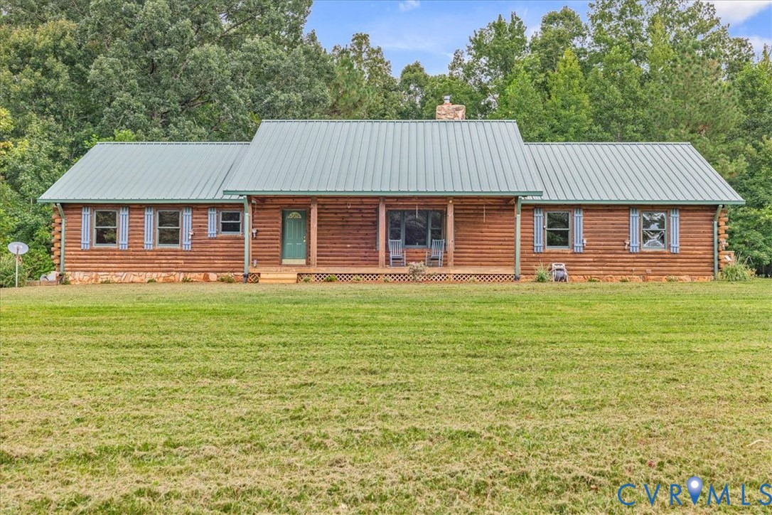 18901 Shippings Road Dewitt, VA 23840 - Photo 2 of 50 a front view of a house with a garden