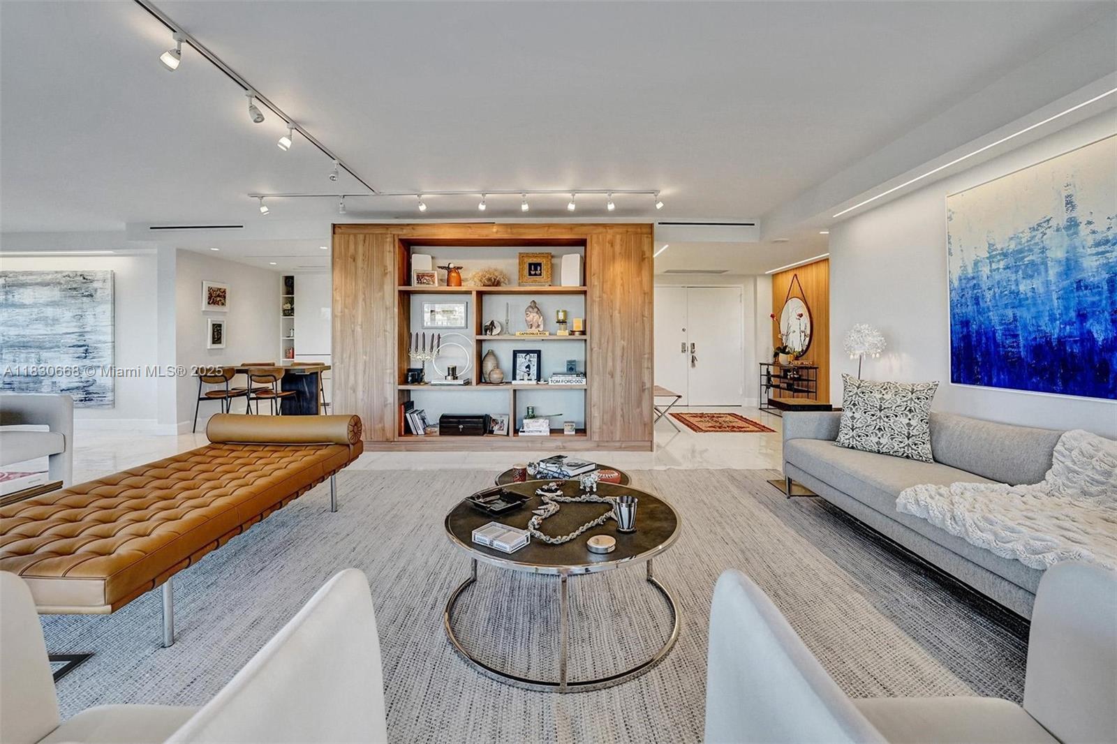 2 Grove Isle Drive, Unit B410 Miami, FL 33133 - Photo 11 of 43 a living room with furniture and a table