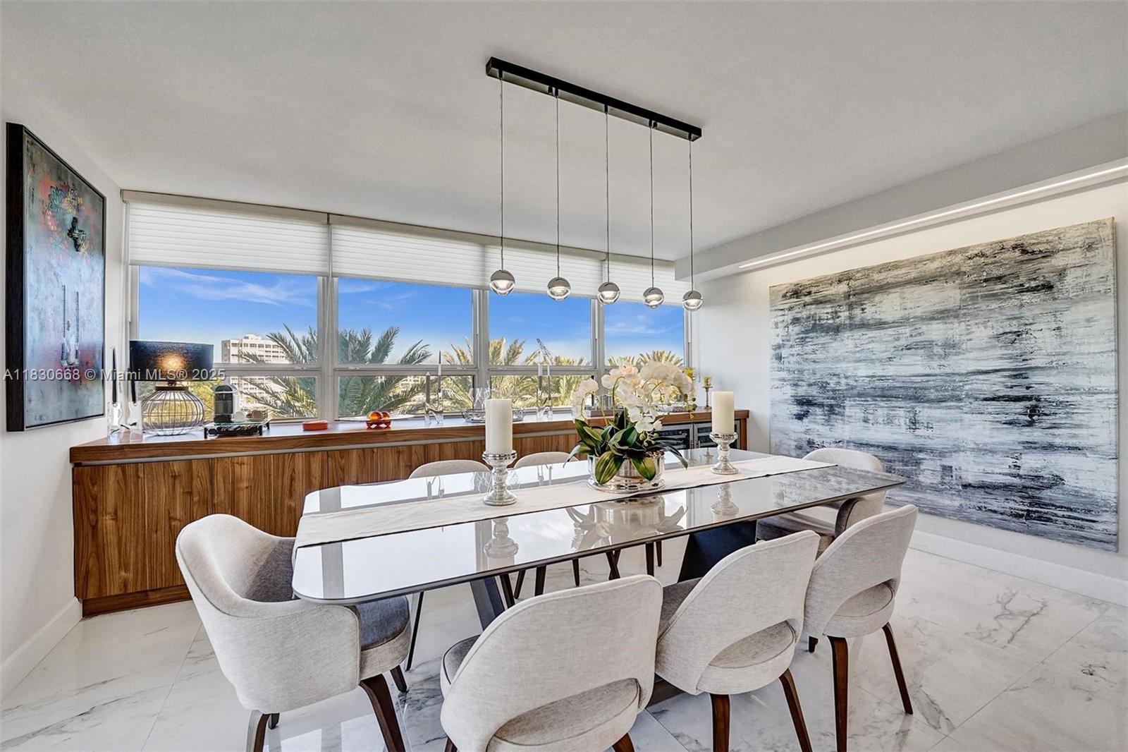 2 Grove Isle Drive, Unit B410 Miami, FL 33133 - Photo 16 of 43 a dining room with furniture and window