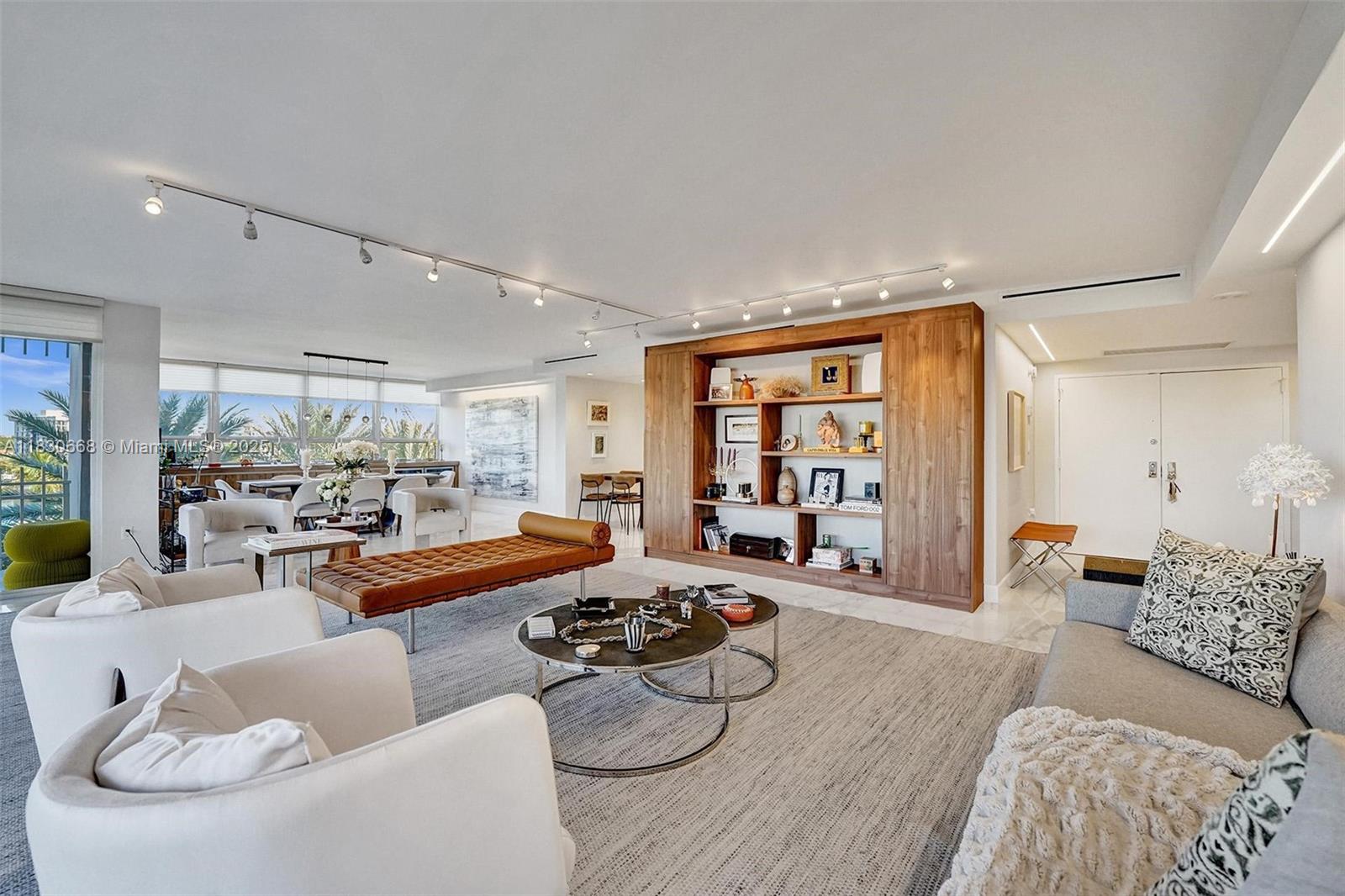 2 Grove Isle Drive, Unit B410 Miami, FL 33133 - Photo 18 of 43 a living room with furniture and a large window