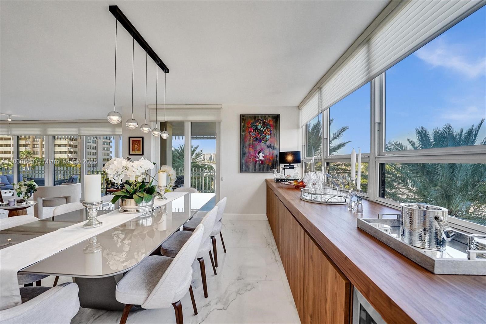 2 Grove Isle Drive, Unit B410 Miami, FL 33133 - Photo 21 of 43 a kitchen with furniture and a large window