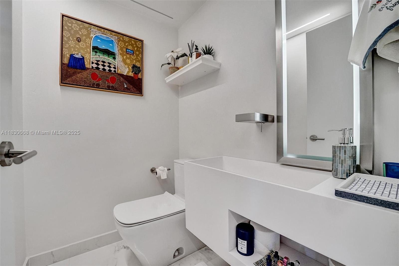 2 Grove Isle Drive, Unit B410 Miami, FL 33133 - Photo 23 of 43 a bathroom with a sink a toilet and shower