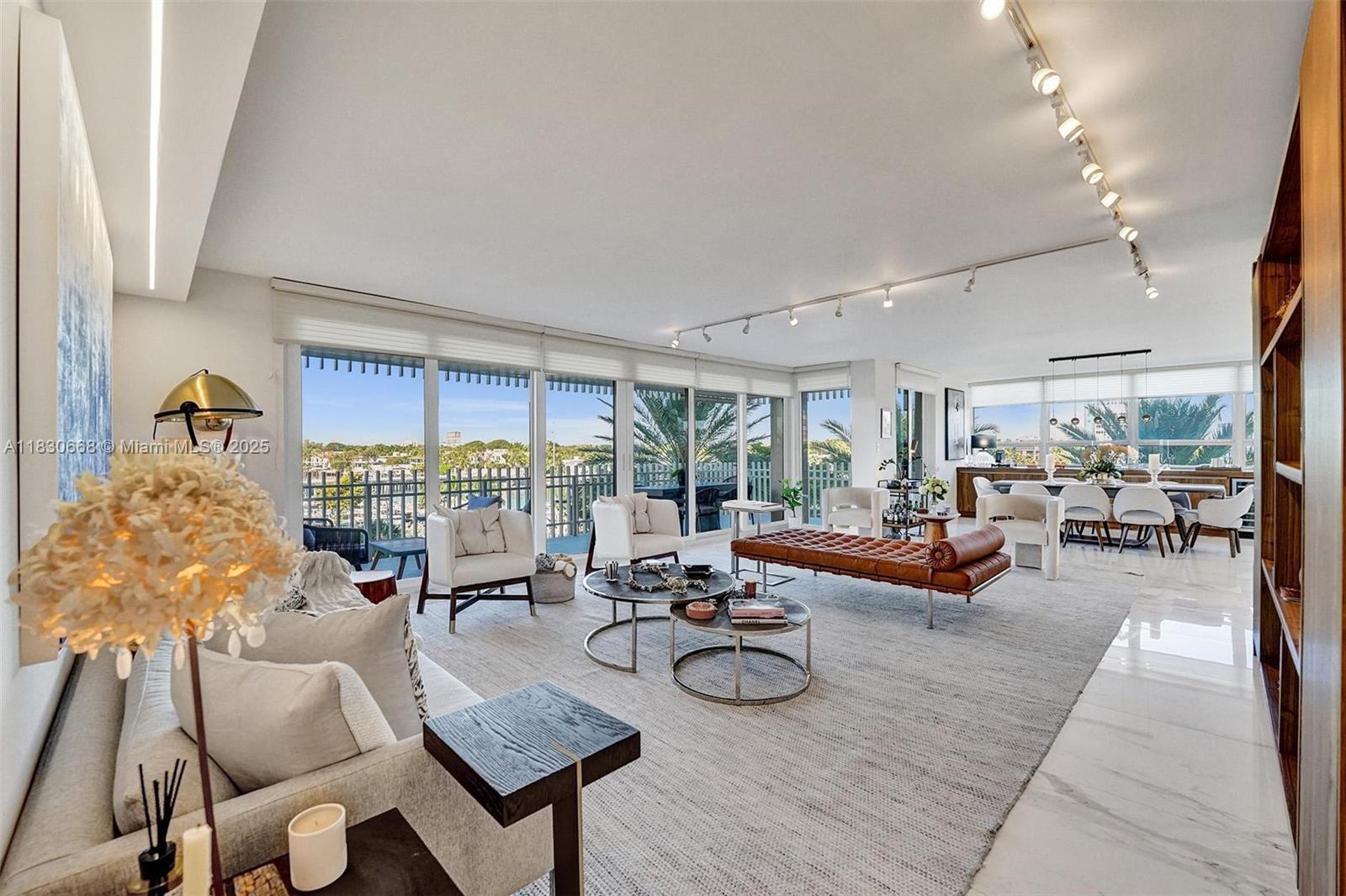 2 Grove Isle Drive, Unit B410 Miami, FL 33133 - Photo 3 of 43 a living room with furniture and a large window