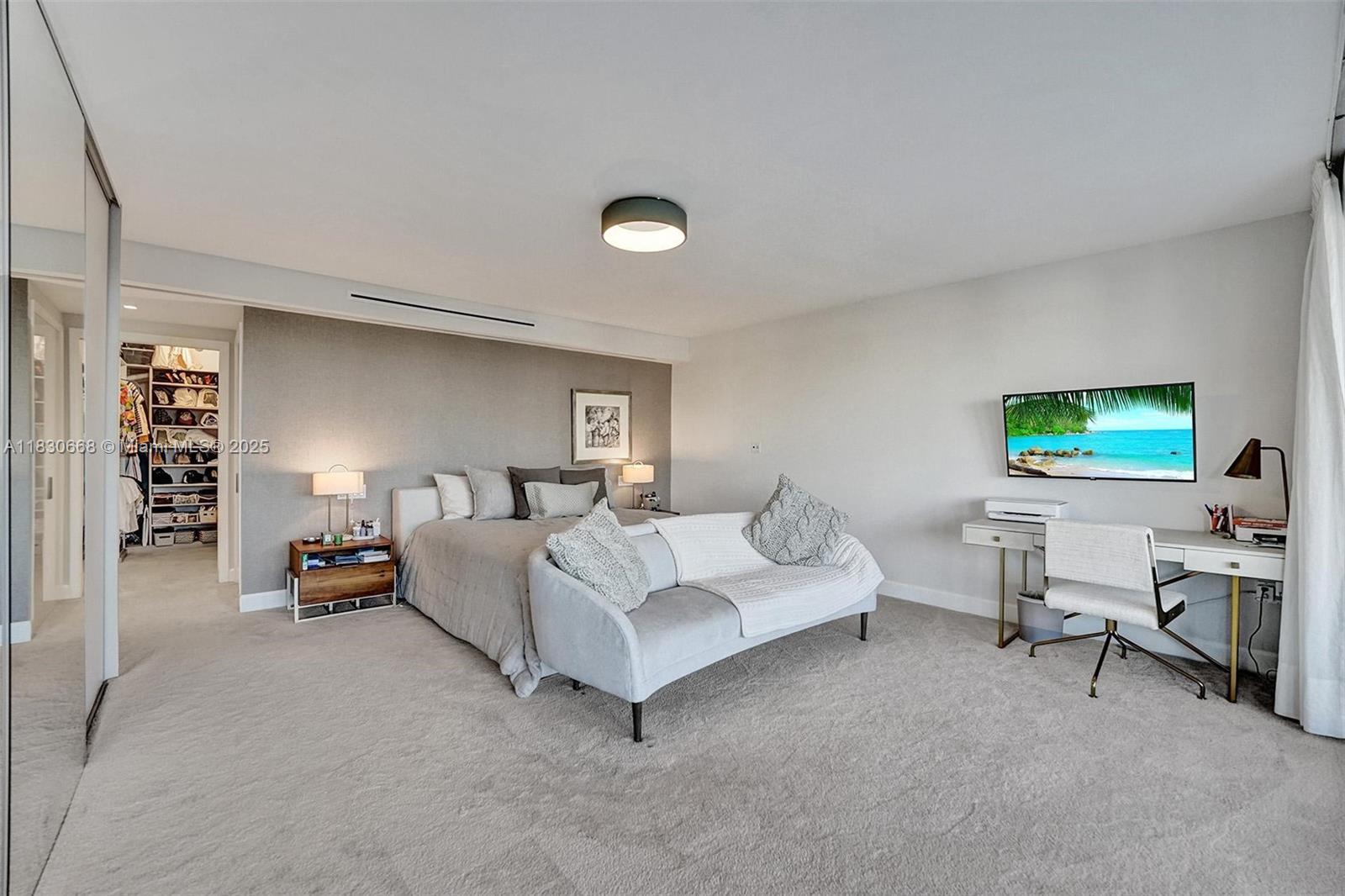 2 Grove Isle Drive, Unit B410 Miami, FL 33133 - Photo 33 of 43 a living room with furniture and a lamp