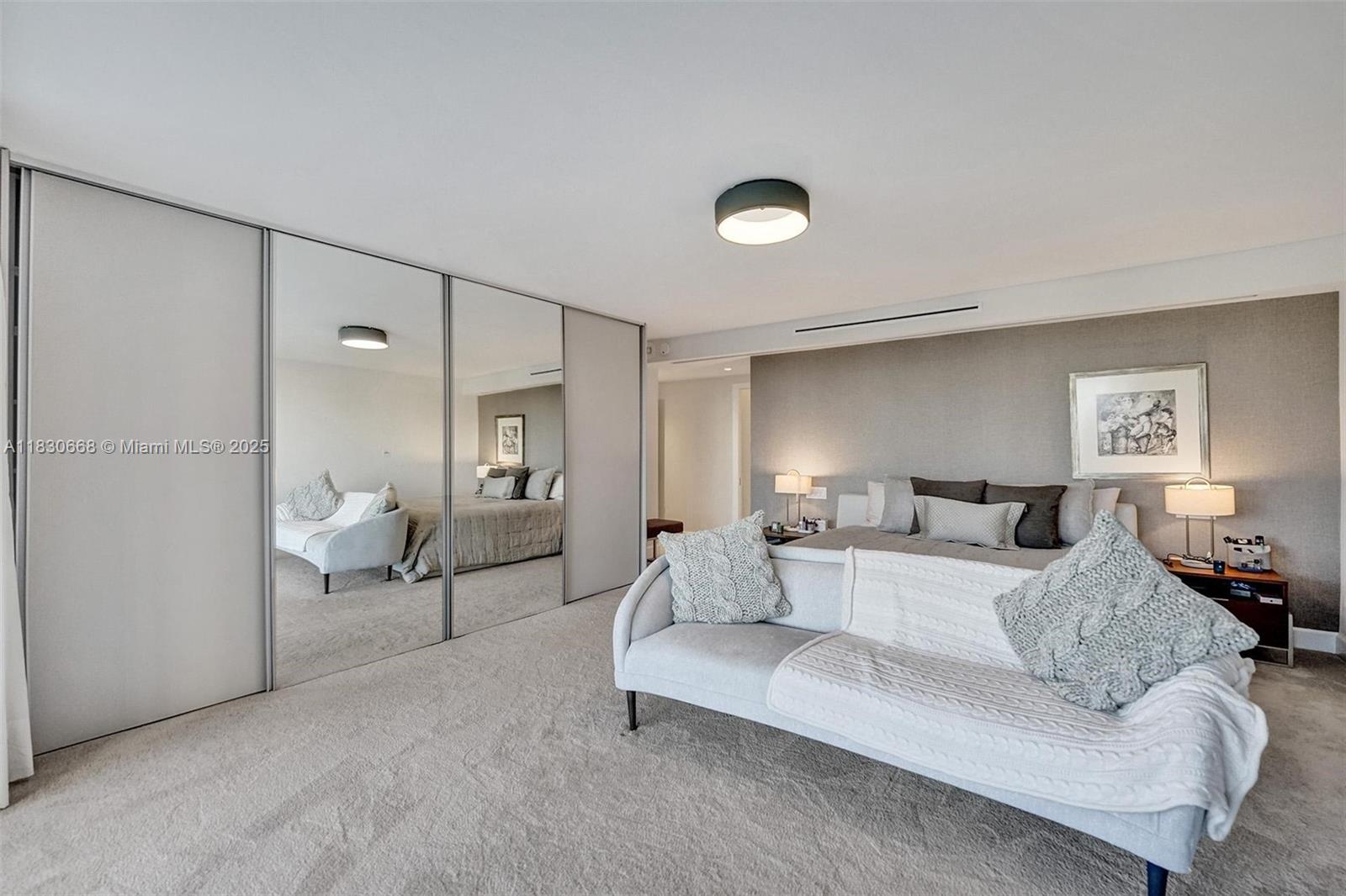 2 Grove Isle Drive, Unit B410 Miami, FL 33133 - Photo 35 of 43 a living room with furniture white walls and lamp