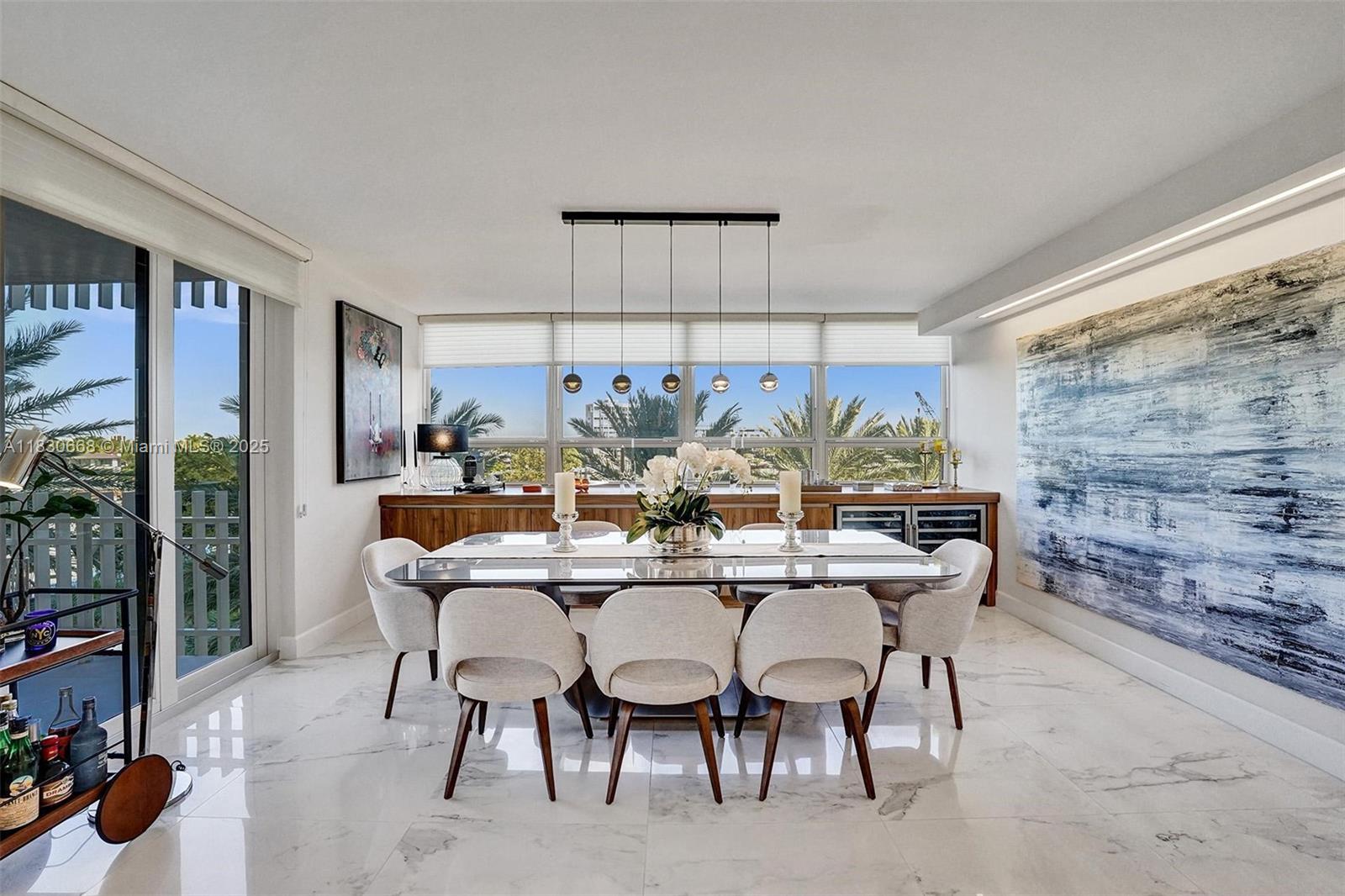 2 Grove Isle Drive, Unit B410 Miami, FL 33133 - Photo 7 of 43 a view of a dining room with furniture and chandelier
