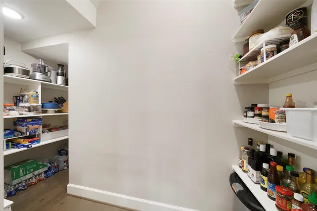 a kitchen with kitchen island a sink stainless steel appliances and cabinets