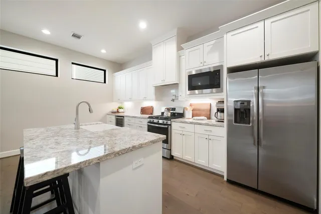 a living room with granite countertop furniture and fireplace