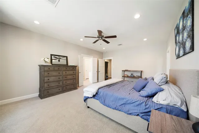 a spacious bathroom with a granite countertop sink a mirror and a shower