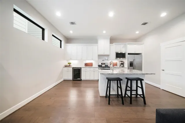 a kitchen with a table and chairs in it