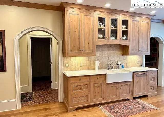 a kitchen with a sink and cabinets