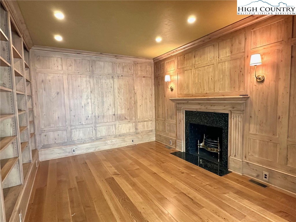 520 East Landing Ridge Circle Jefferson, NC 28640 - Photo 15 of 50 a view of an empty room with a fireplace and a window