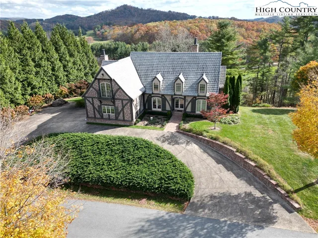 an aerial view of a house with a garden