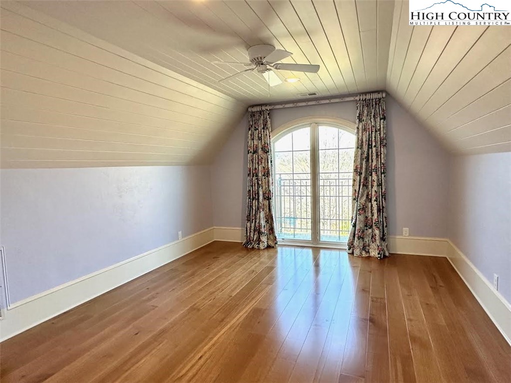 520 East Landing Ridge Circle Jefferson, NC 28640 - Photo 24 of 50 an empty room with wooden floor and windows