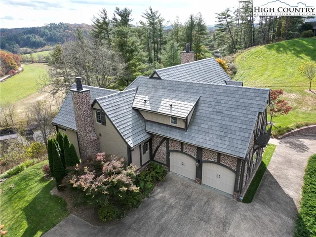 a view of a terrace with a table and chairs