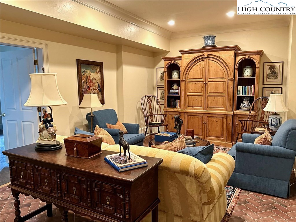 520 East Landing Ridge Circle Jefferson, NC 28640 - Photo 39 of 50 a living room with furniture a rug and a chandelier