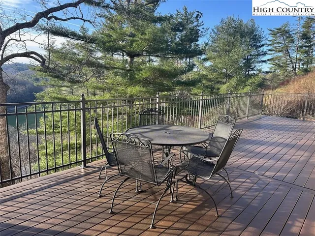 a view of a chairs and table in the balcony