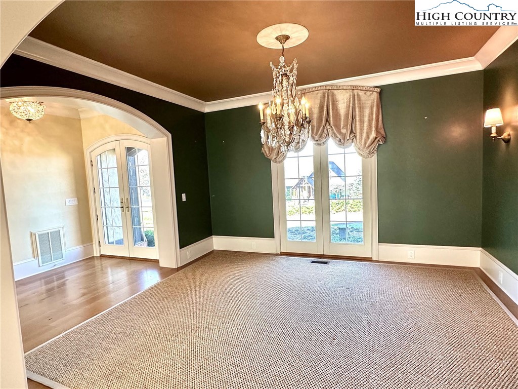 520 East Landing Ridge Circle Jefferson, NC 28640 - Photo 7 of 50 a view of an empty room with a chandelier