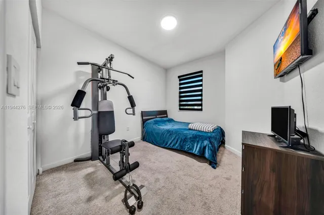 a bedroom with furniture and a window