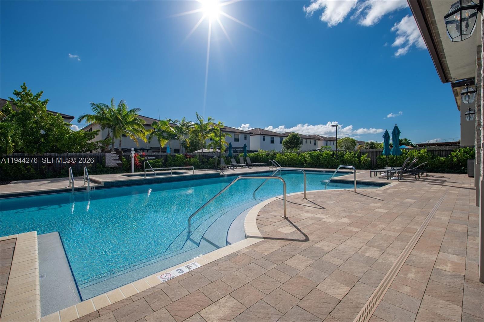 24985 Southwest 107th Court Homestead, FL 33032 - Photo 20 of 22 a view of a swimming pool with a yard