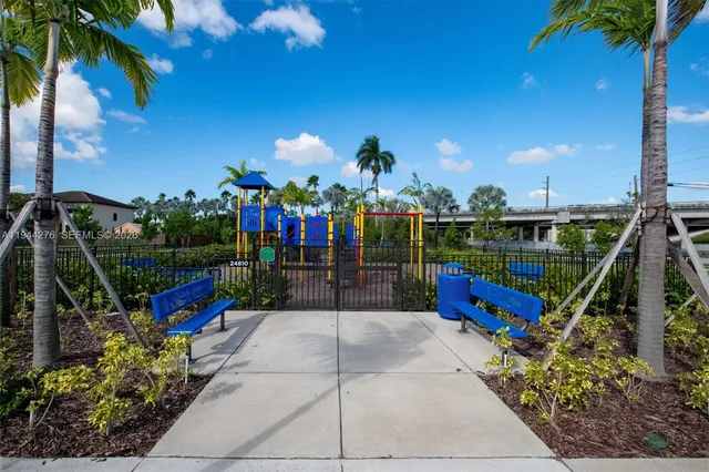 a view of a park with a slide