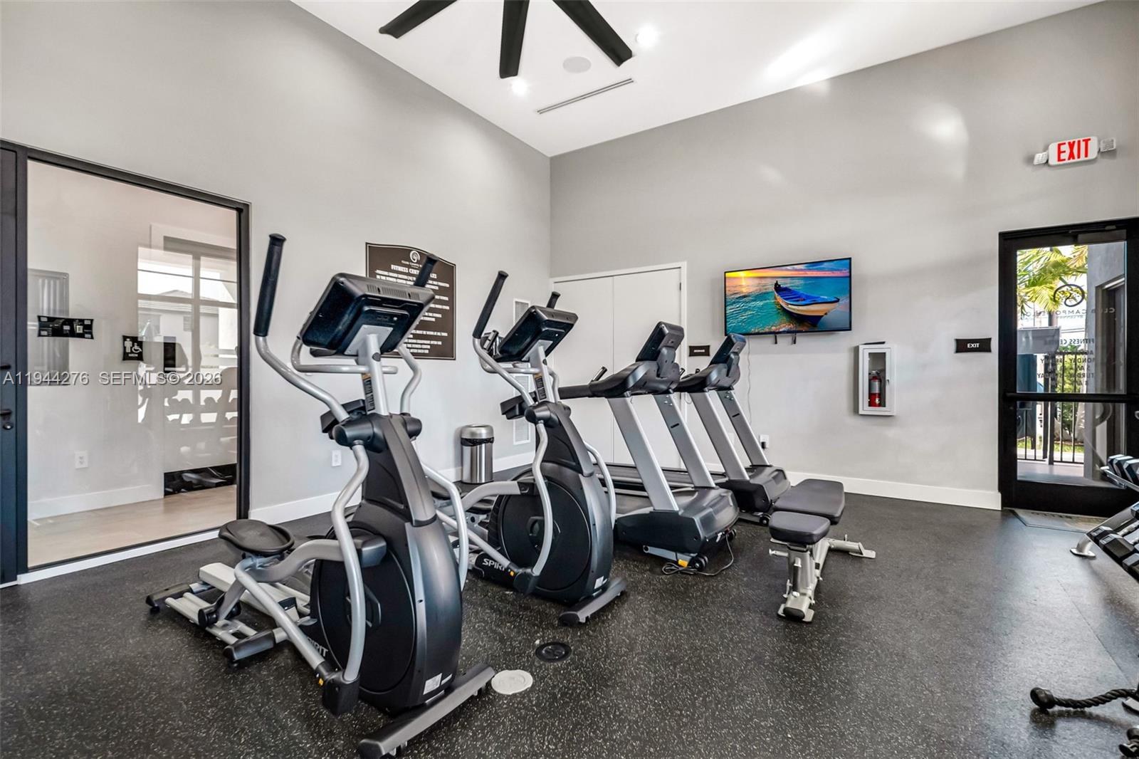 24985 Southwest 107th Court Homestead, FL 33032 - Photo 22 of 22 a view of a room with gym equipment