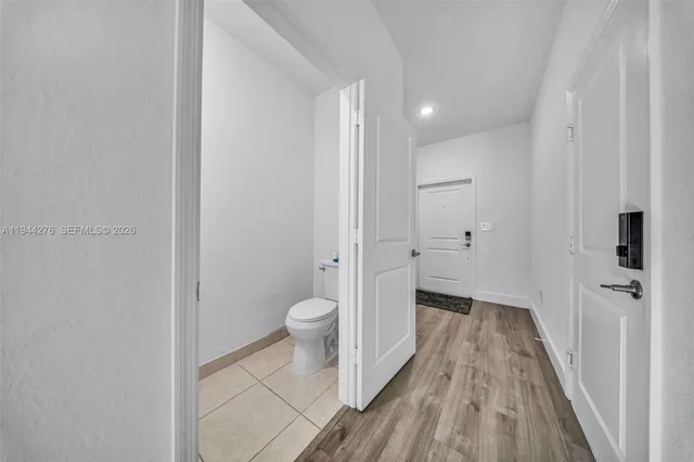 a bathroom with a sink a toilet and a shower