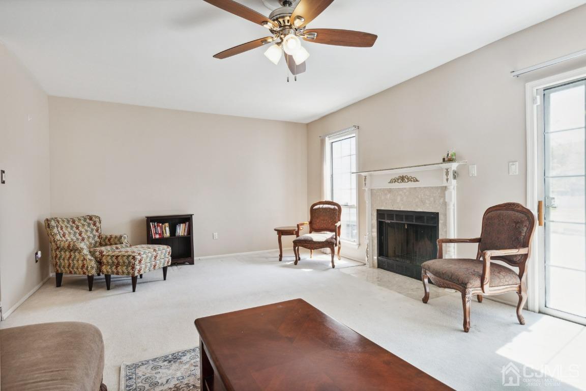 333 Devon Place Morganville, NJ 07751 - Photo 4 of 17 a living room with furniture and a fireplace
