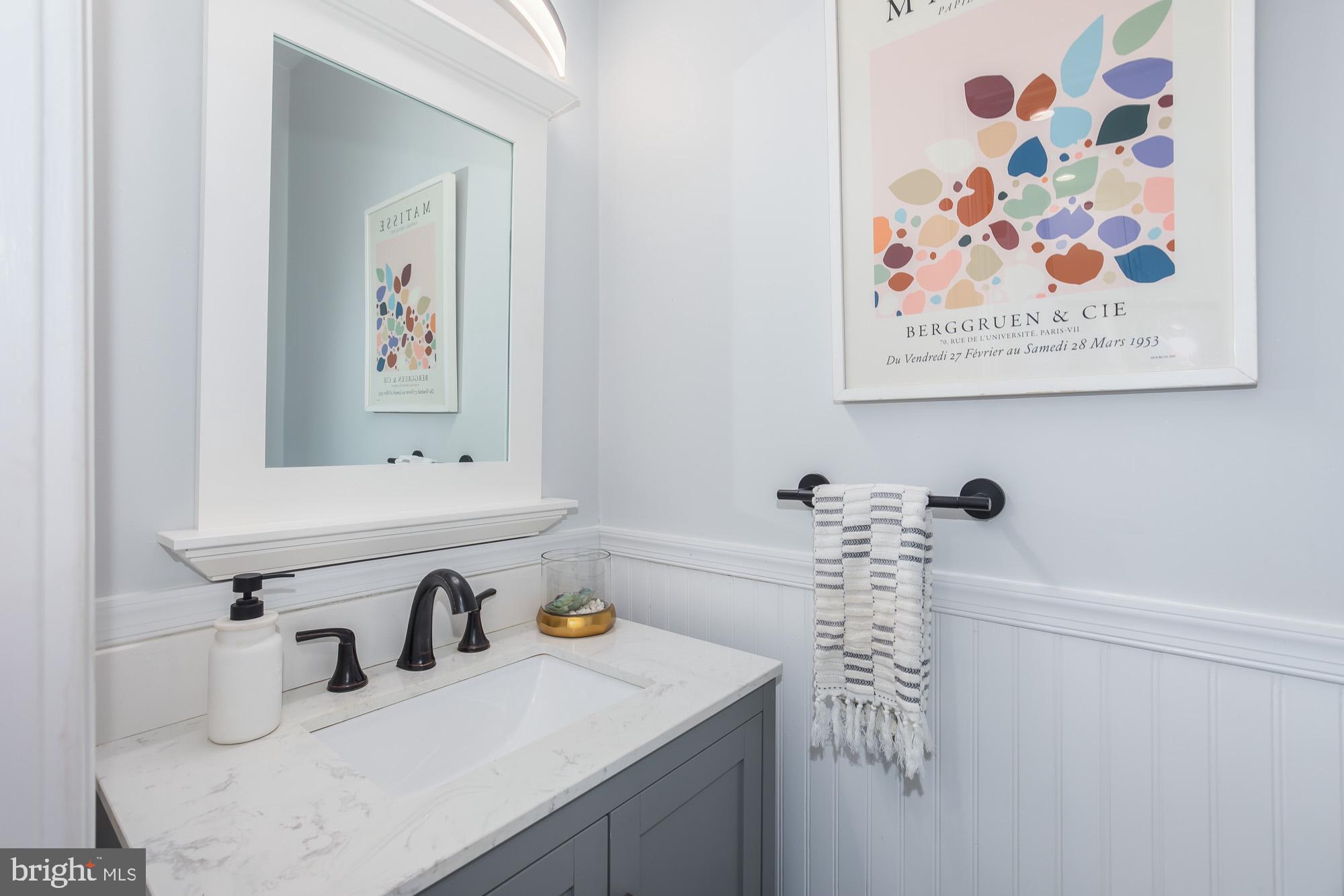 420 4th Street Southeast Washington, DC 20003 - Photo 17 of 31 a bathroom with a sink and a mirror