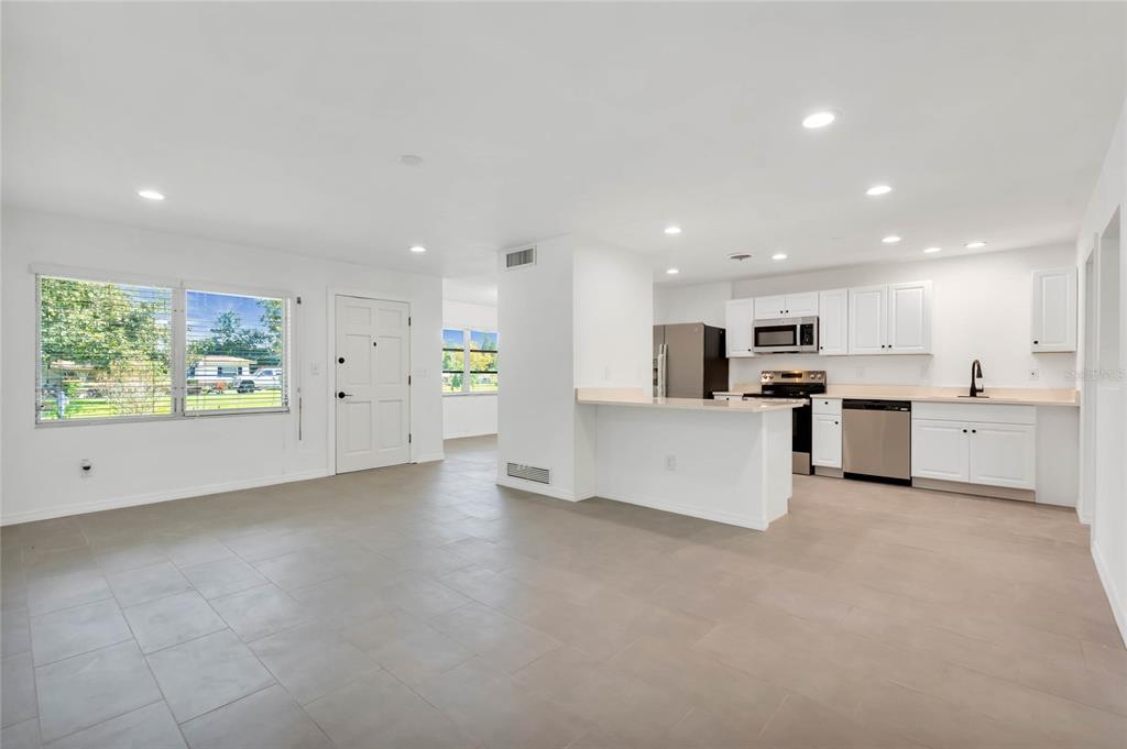 448 Ridge Drive Sanford, FL 32773 - Photo 2 of 20 a view of kitchen with kitchen island and stainless steel appliances