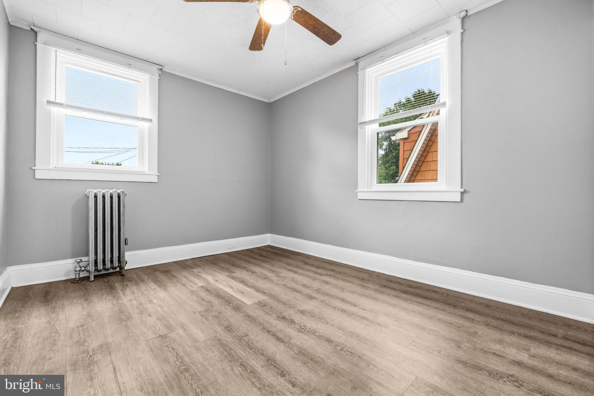 12 Leeway Dundalk, MD 21222 - Photo 17 of 34 an empty room with wooden floor and windows