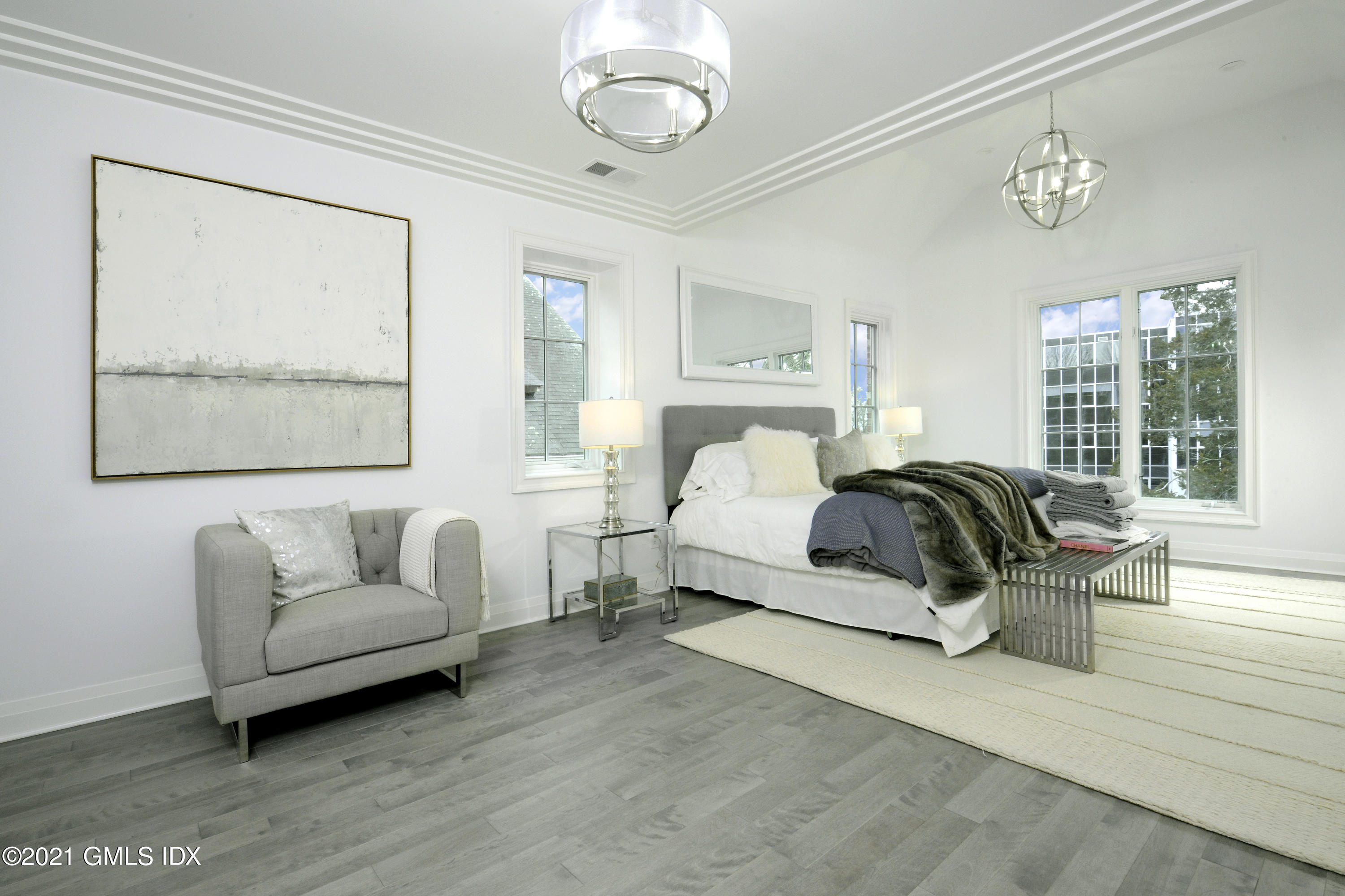 36 Washington Avenue Greenwich, CT 06830 - Photo 15 of 32 a bedroom with a bed couch and window