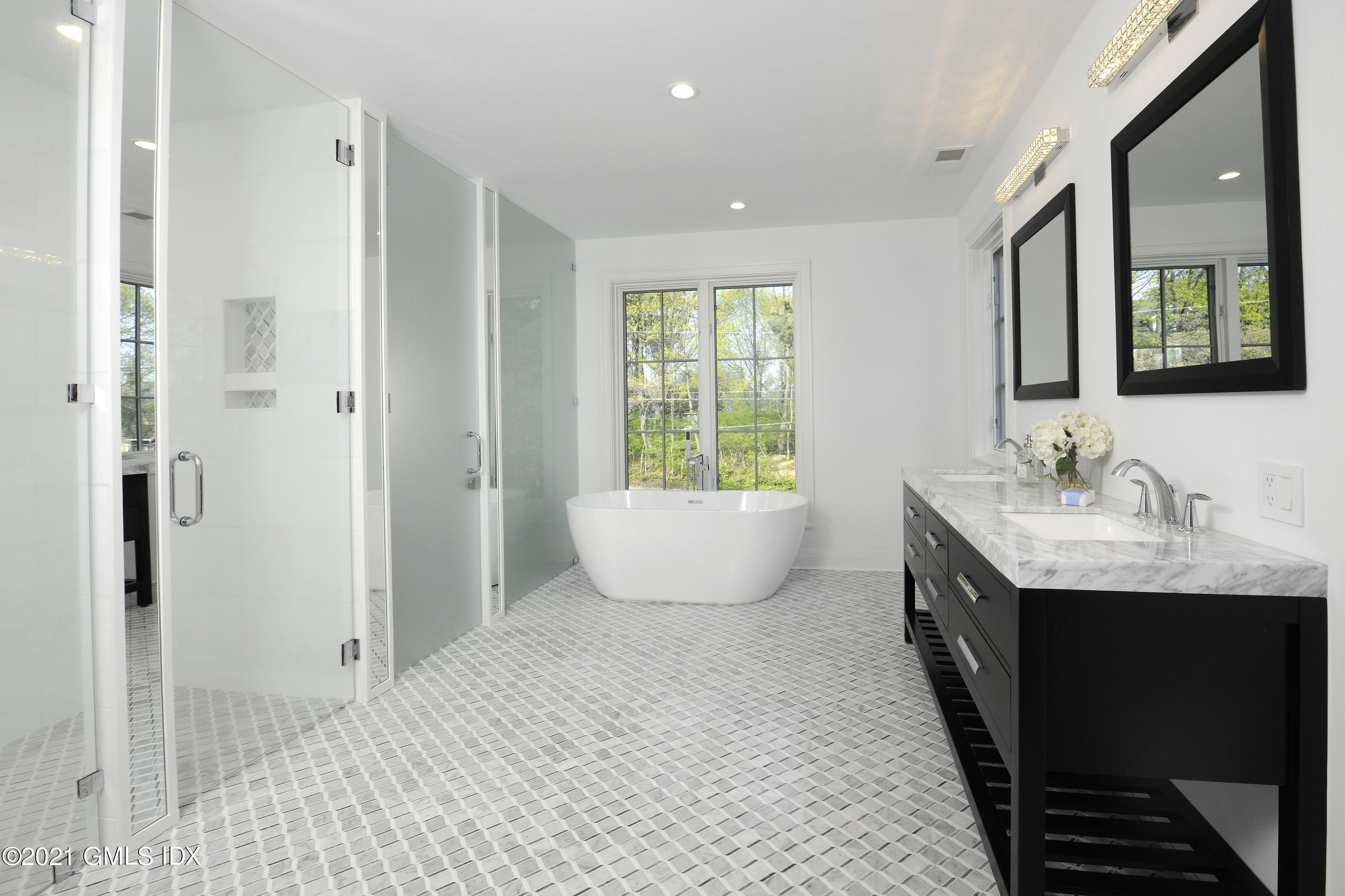 36 Washington Avenue Greenwich, CT 06830 - Photo 17 of 32 a bathroom with a granite countertop sink and a mirror