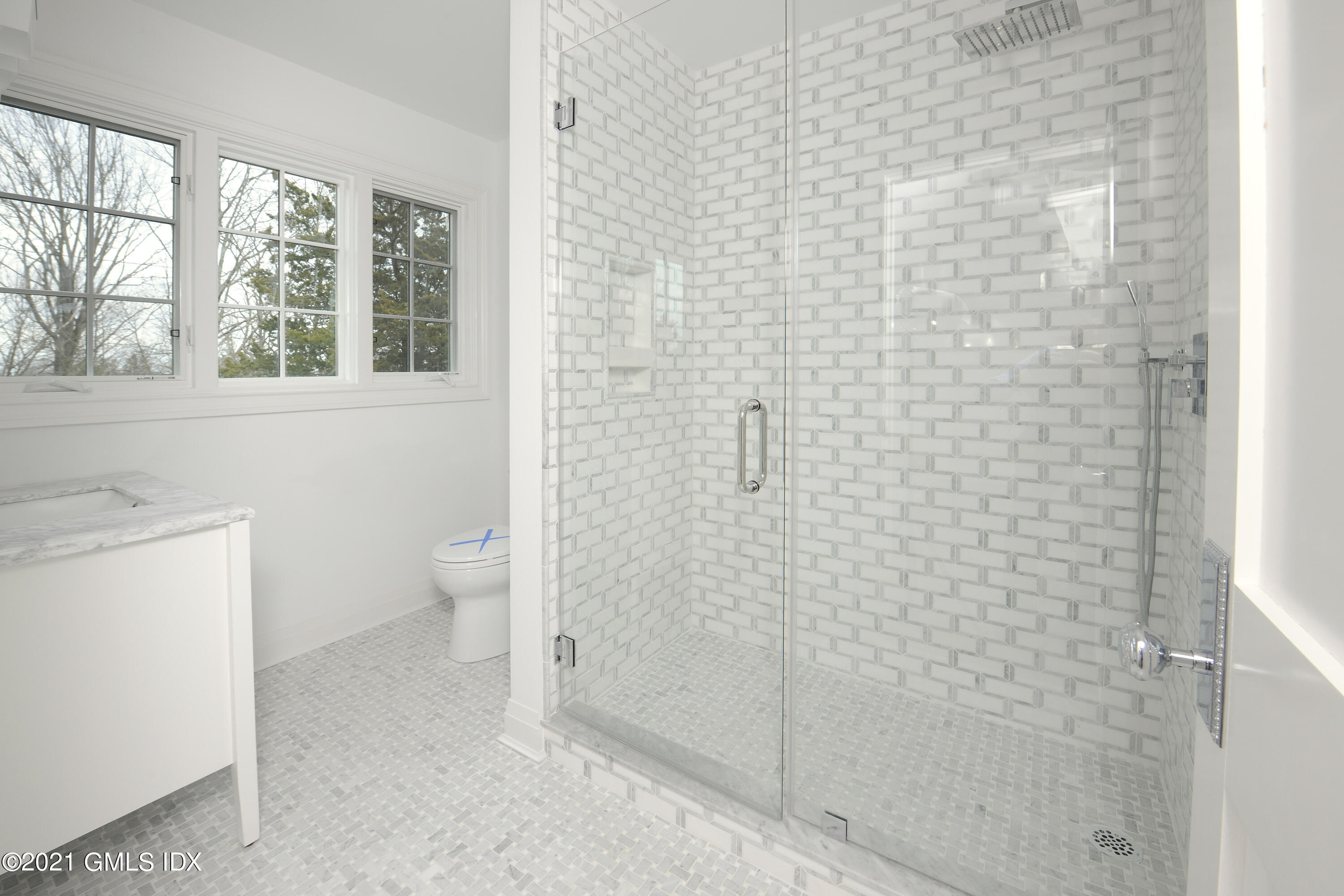 36 Washington Avenue Greenwich, CT 06830 - Photo 21 of 32 a bathroom with a toilet and a shower