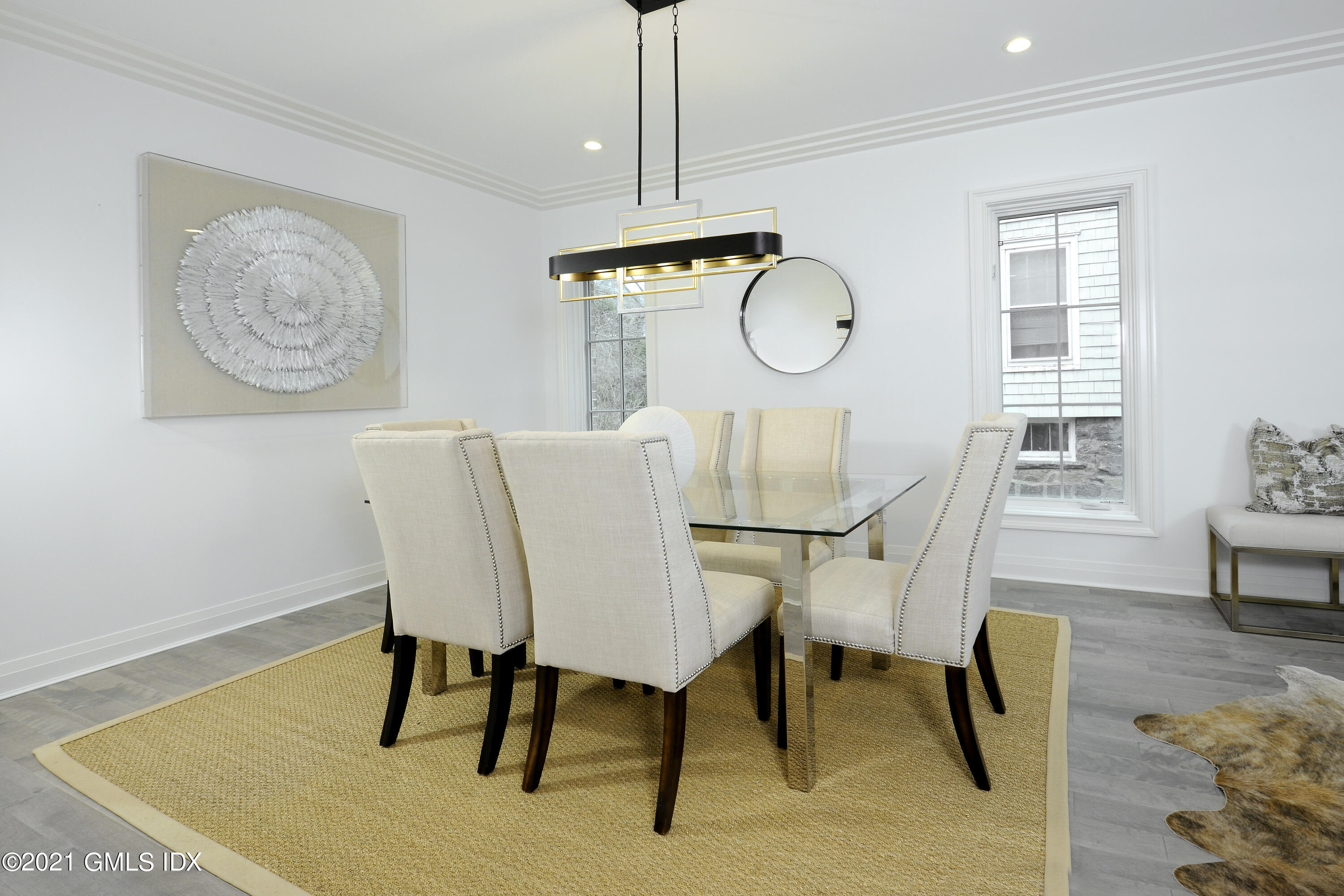 36 Washington Avenue Greenwich, CT 06830 - Photo 5 of 32 a view of a dining room with furniture and wooden floor