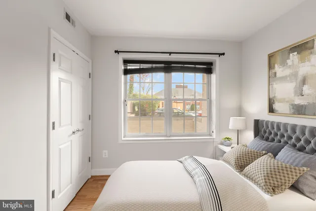 a bedroom with bed and window