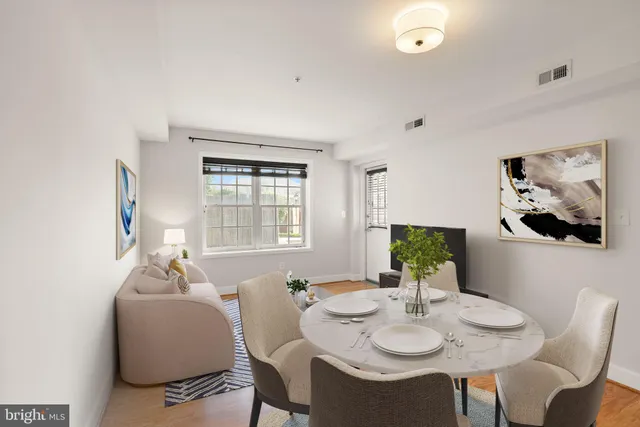 a view of a dining room with furniture and window