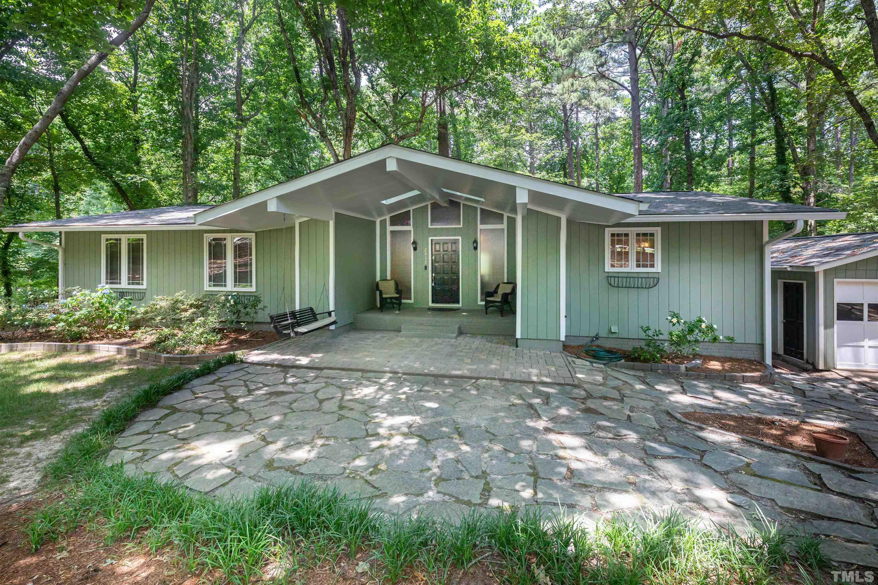2612 Salisbury Plain Raleigh, NC 27613 - Photo 1 of 22 a front view of a house with yard and green space