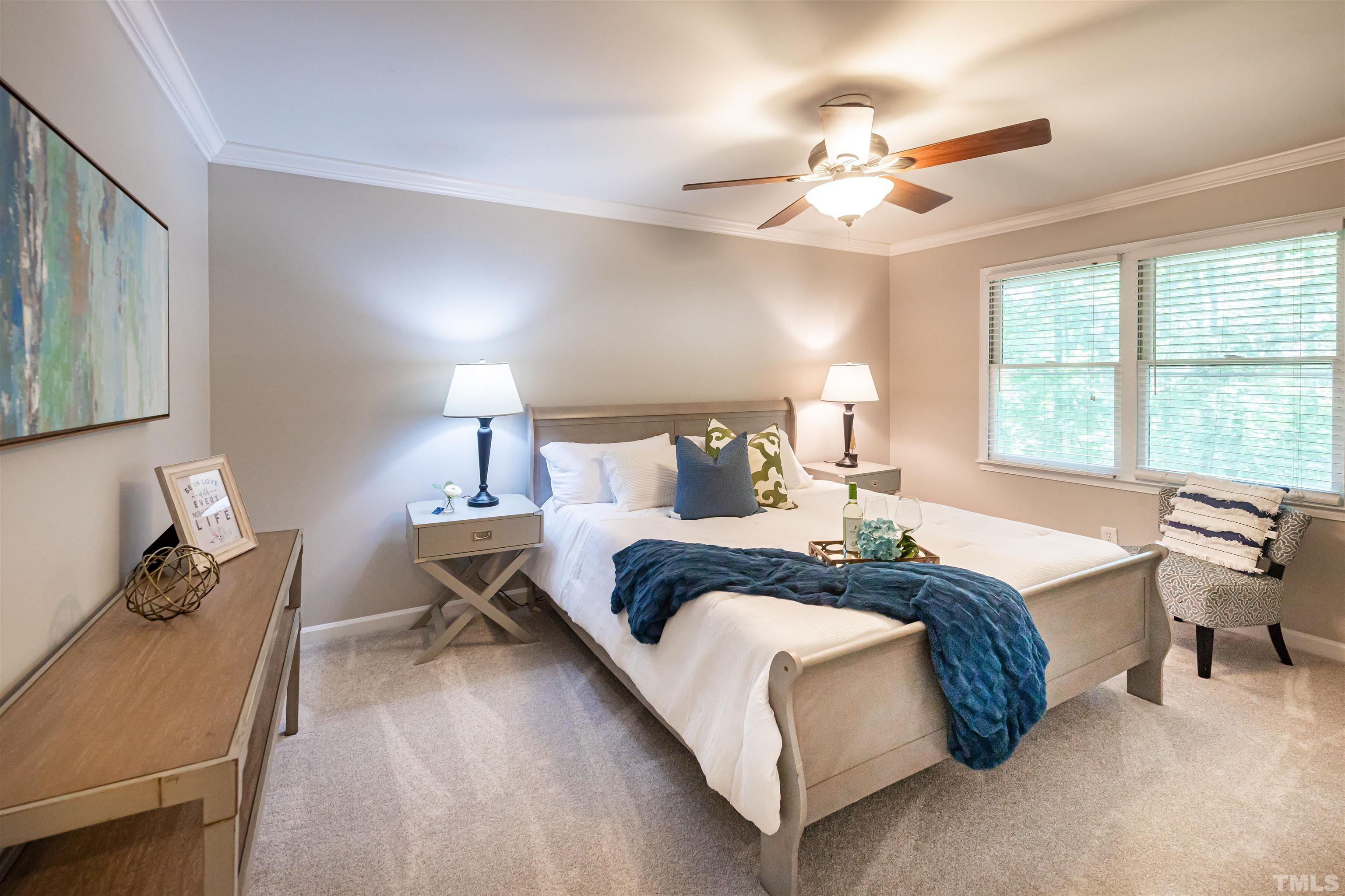 2612 Salisbury Plain Raleigh, NC 27613 - Photo 11 of 22 a bed room with a bed and a chair