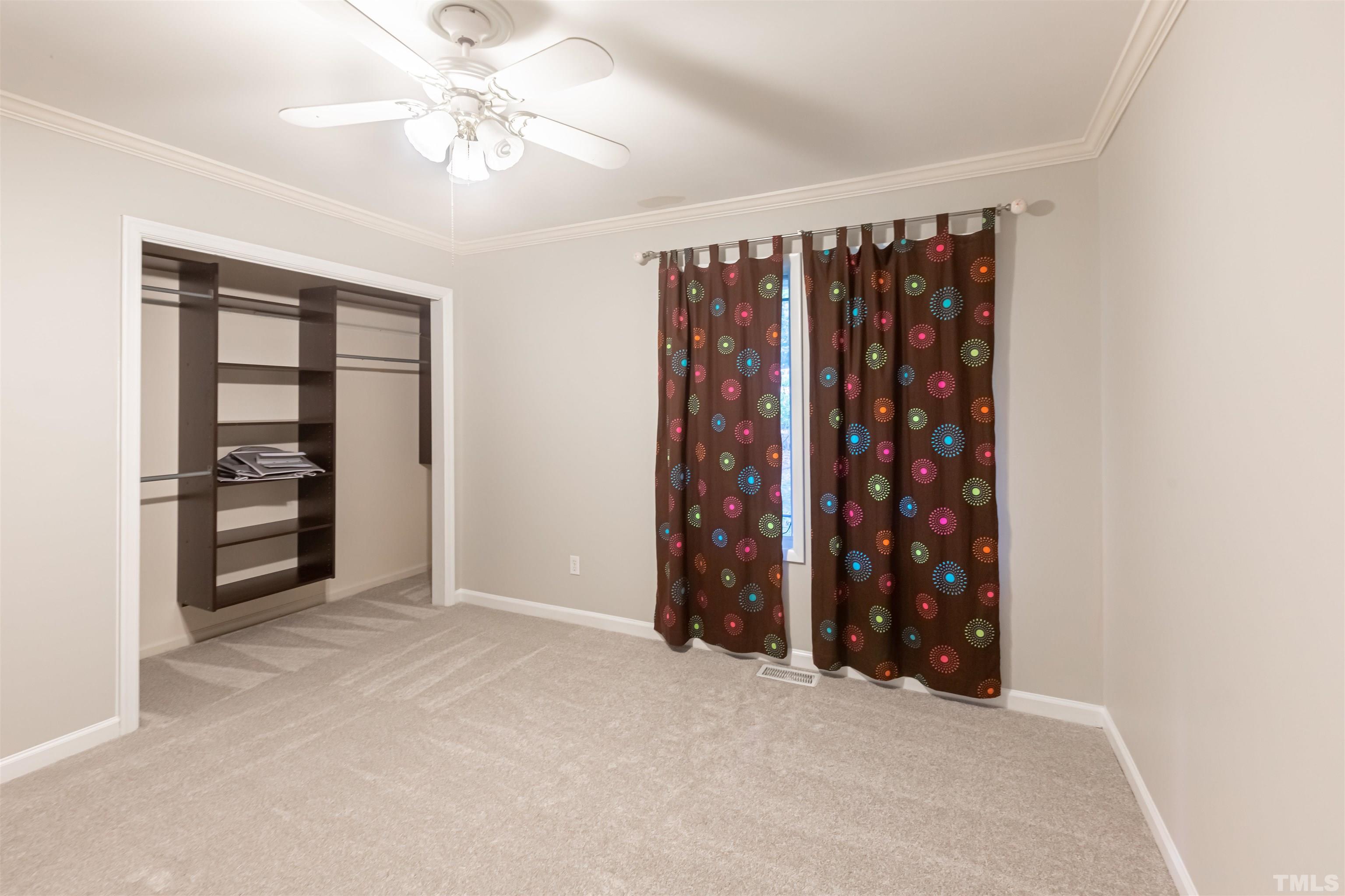 2612 Salisbury Plain Raleigh, NC 27613 - Photo 14 of 22 an empty room with windows and closet