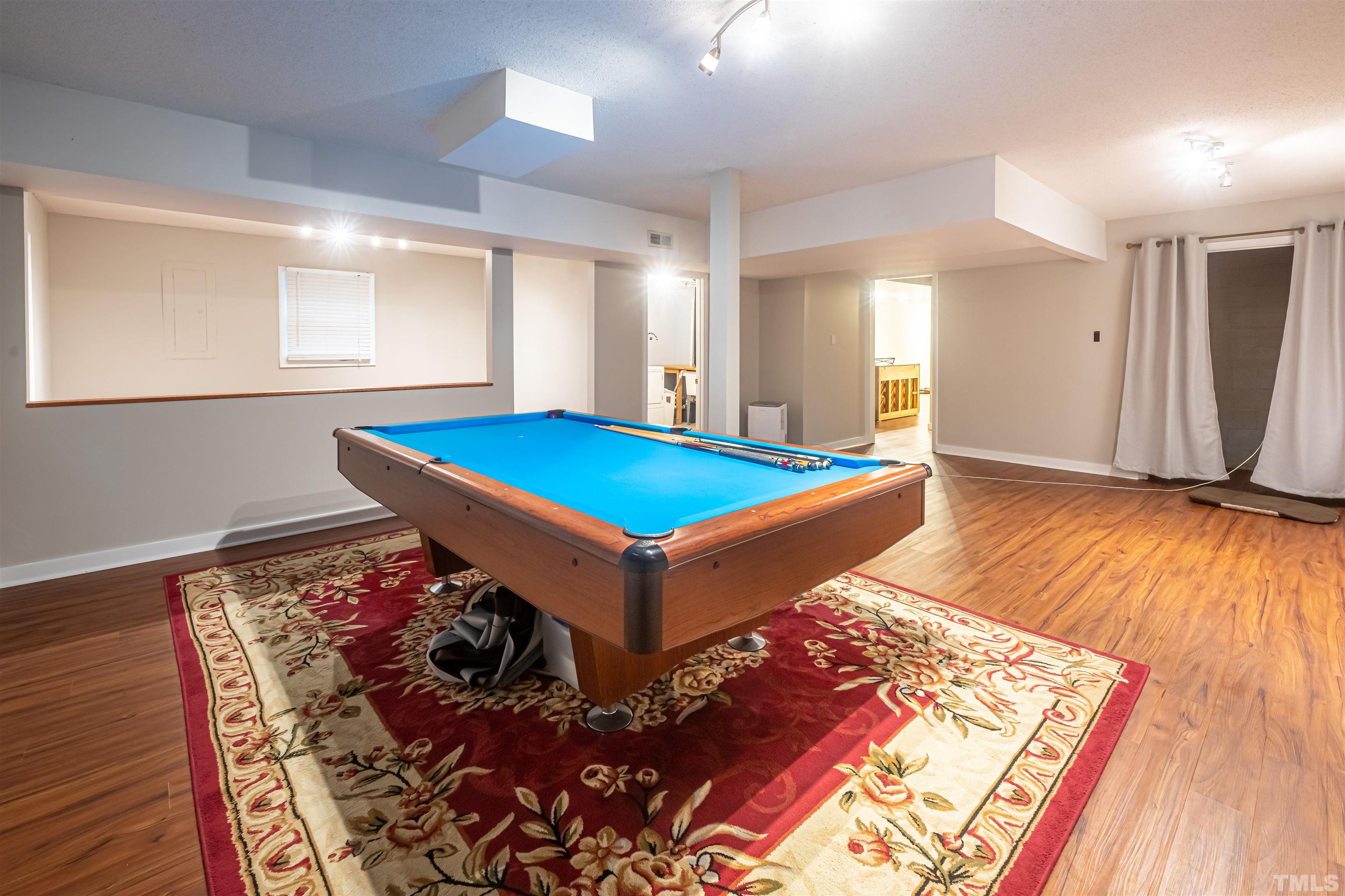 2612 Salisbury Plain Raleigh, NC 27613 - Photo 17 of 22 a room with pool table and a window