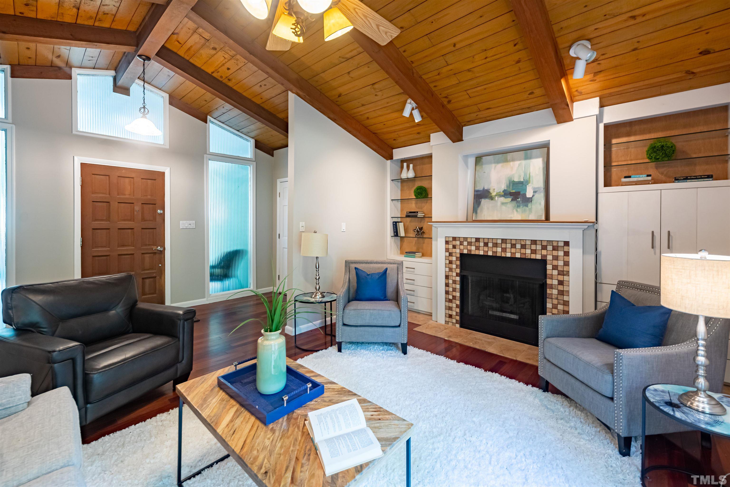 2612 Salisbury Plain Raleigh, NC 27613 - Photo 2 of 22 a living room with furniture and a fireplace