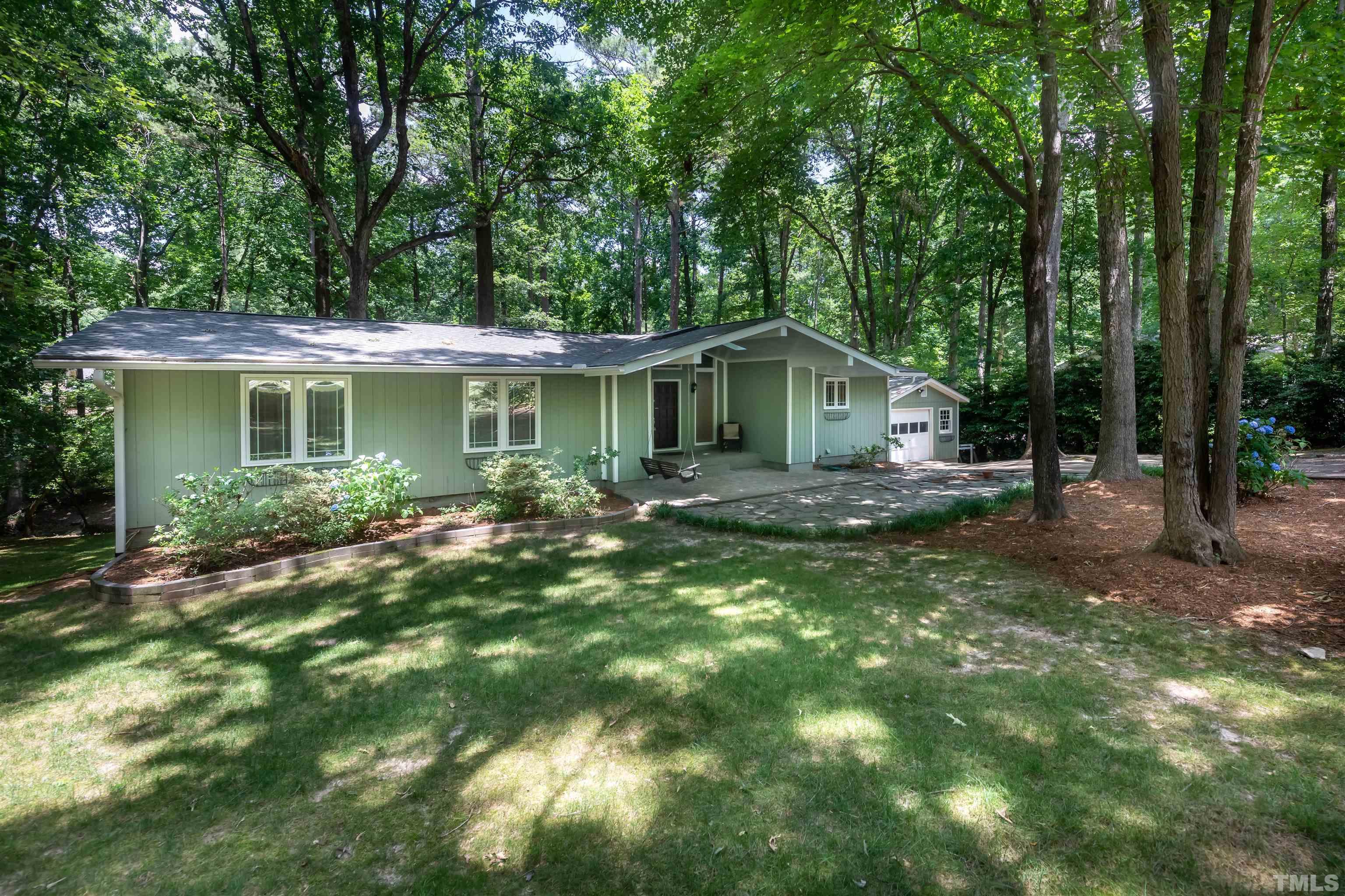 2612 Salisbury Plain Raleigh, NC 27613 - Photo 21 of 22 a front view of a house with a yard