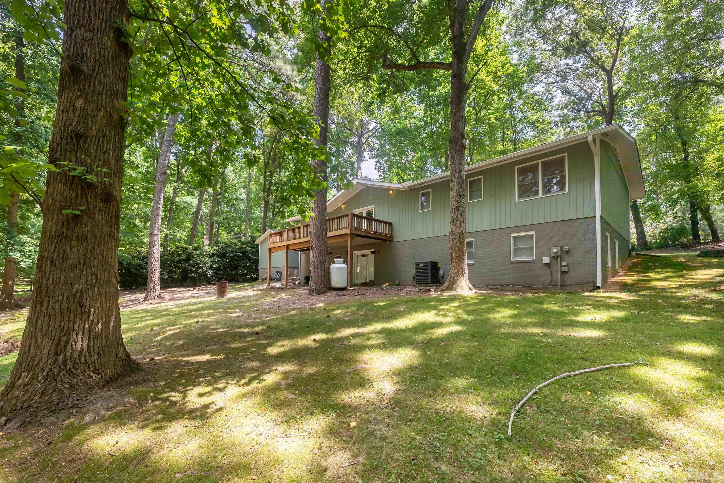 2612 Salisbury Plain Raleigh, NC 27613 - Photo 22 of 22 a front view of a house with a yard and garage