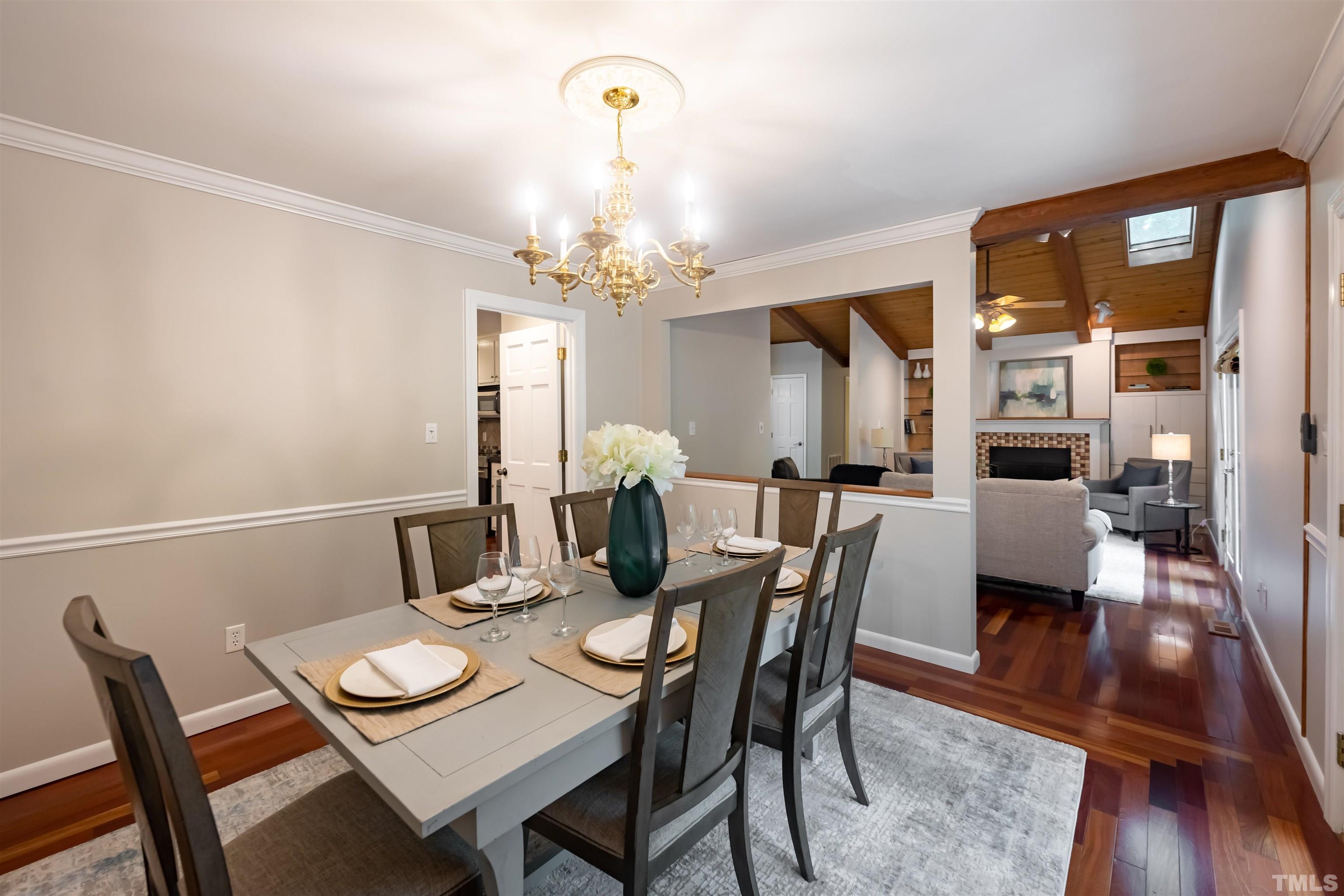 2612 Salisbury Plain Raleigh, NC 27613 - Photo 5 of 22 a view of a dining room with furniture and wooden floor