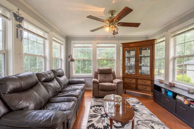 a living room with furniture and windows