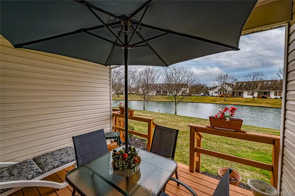 a view of a lake with houses in the back