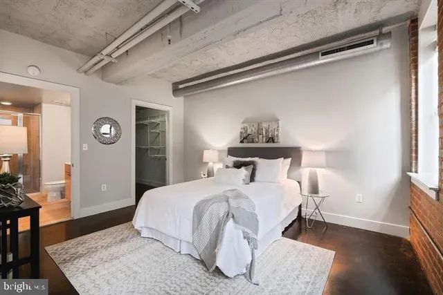 a bedroom with a bed and a table