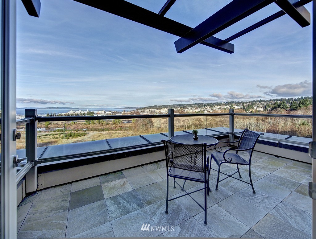61 Pine Street, Unit 302 Edmonds, WA 98020 - Photo 14 of 25 a view of a chairs and table in patio